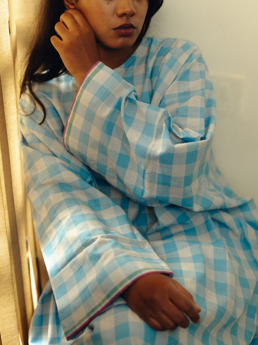 Person wearing a Free size kurta - Light blue checks sitting against a plain background