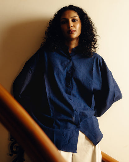 Woman wearing a Shirt - Blueberry Plain against a neutral background